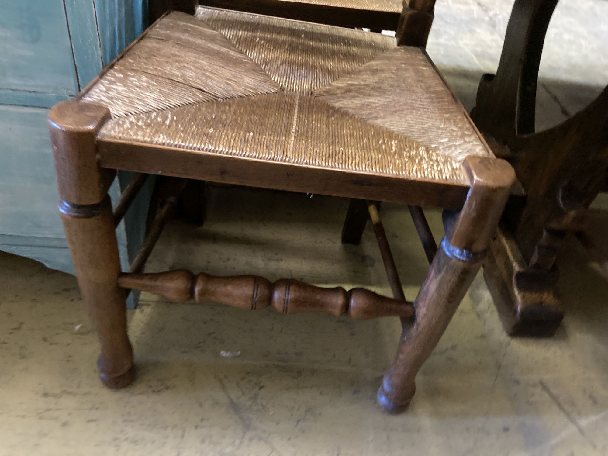 A set of six oak rush seated ladderback dining chairs